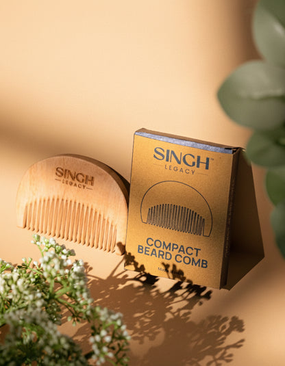 Singh Legacy Compact Beard Comb – lifestyle with gold box and flowers